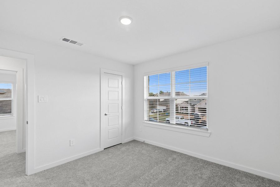 Spacious, unfurnished interior of a new home in Pinewood at Grand Texas, New Caney (Image 27).