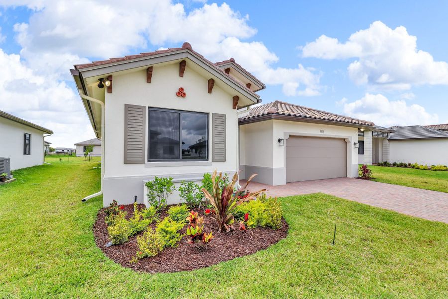Front exterior of a home in the Maple Ridge community, located in Ave Maria, FL (Image 1). Front exterior of a home in the Maple Ridge community, located in Ave Maria, FL (Image 1).