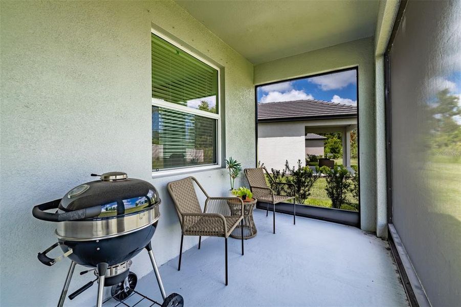 Exterior details and patio area of a home in Prosperity Lakes, Parrish (Image 3).
