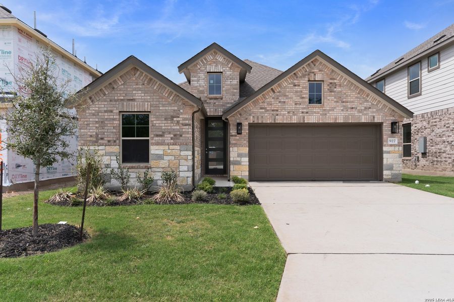 Front exterior of a new home in Clear Creek, New Braunfels, TX, highlighting curb appeal (Image 1). Front exterior of a new home in Clear Creek, New Braunfels, TX, highlighting curb appeal (Image 1).