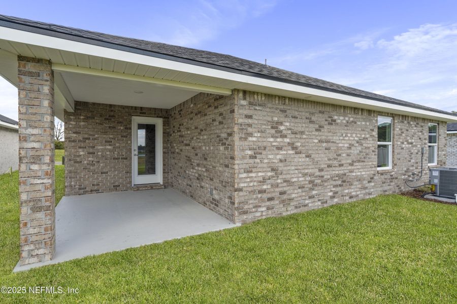 Exterior details and patio area of a home in Shadow Crest at Rolling Hills, Green Cove Springs (Image 4). Exterior details and patio area of a home in Shadow Crest at Rolling Hills, Green Cove Springs (Image 4).
