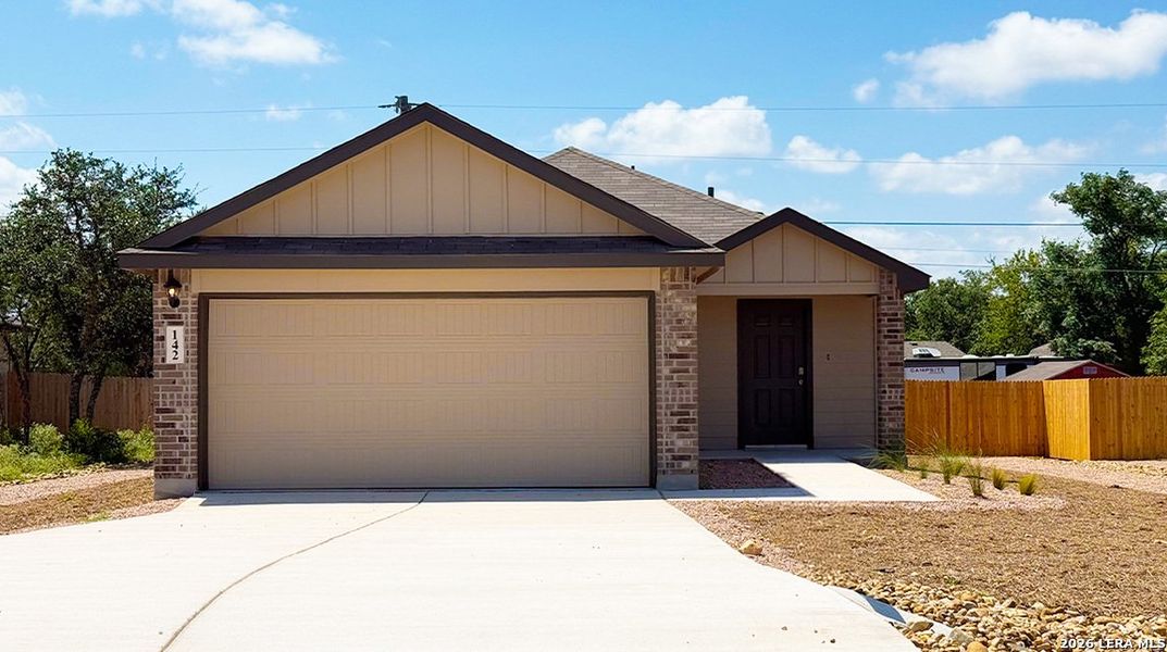 Front exterior of a new home in High Garden, Comfort, TX, highlighting curb appeal (Image 2).
