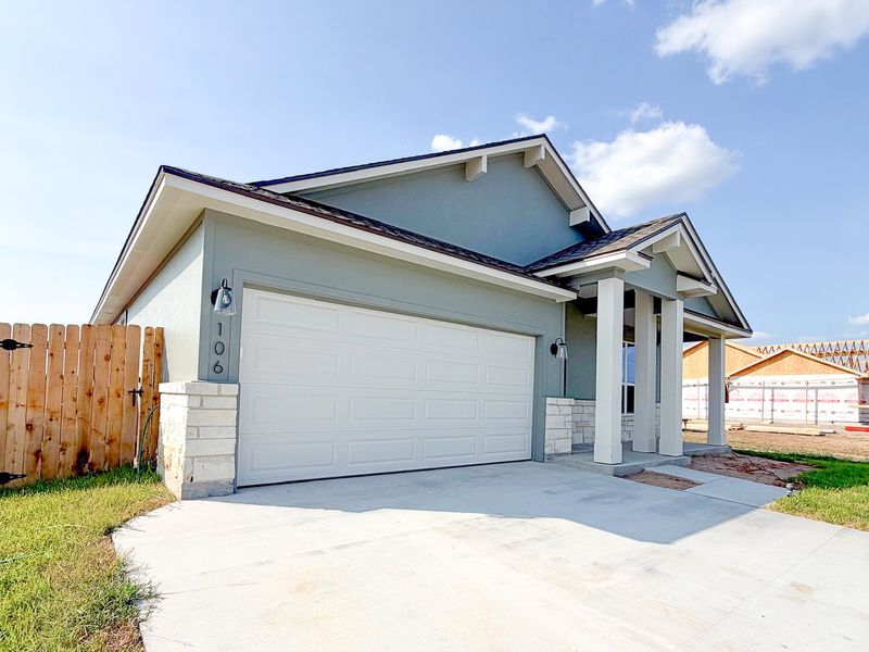 Front exterior of a new home in TerraVista, Victoria, TX, highlighting curb appeal (Image 25).