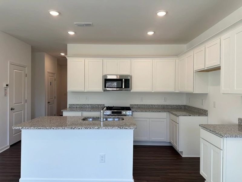 Kitchen - Chic white finishes and smooth surfaces shine. Kitchen - Chic white finishes and smooth surfaces shine.