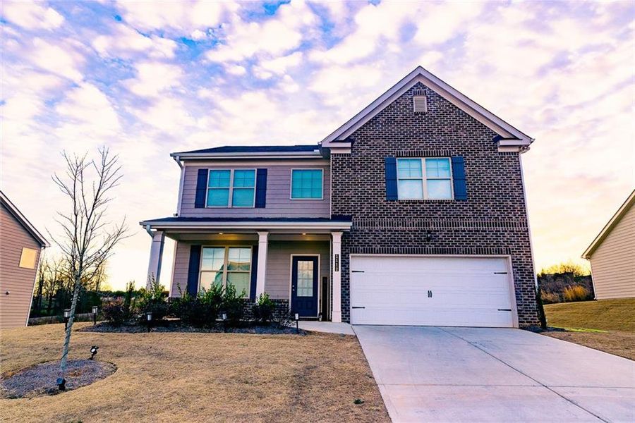 Front exterior of a new home in Hellen Valley, Braselton, GA, highlighting curb appeal (Image 22).