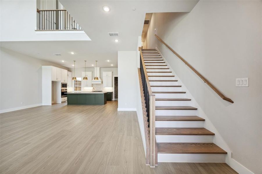 Solid Oak Stairs and Railings featuring Wrought Iron spindles
