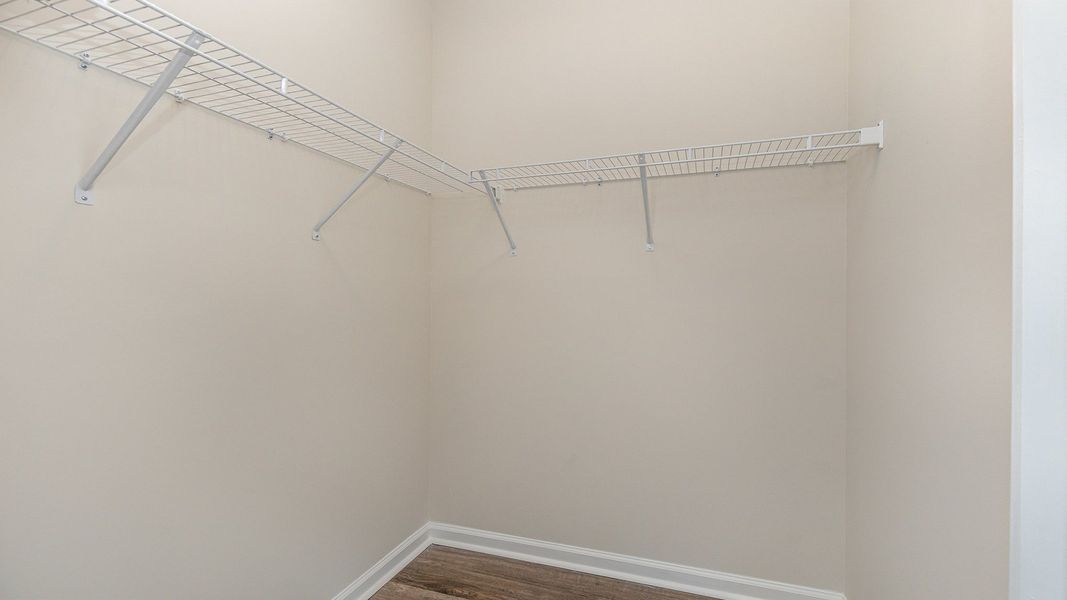 Spacious, unfurnished interior of a new home in Rich Square at Brunswick Plantation, Ash (Image 17).