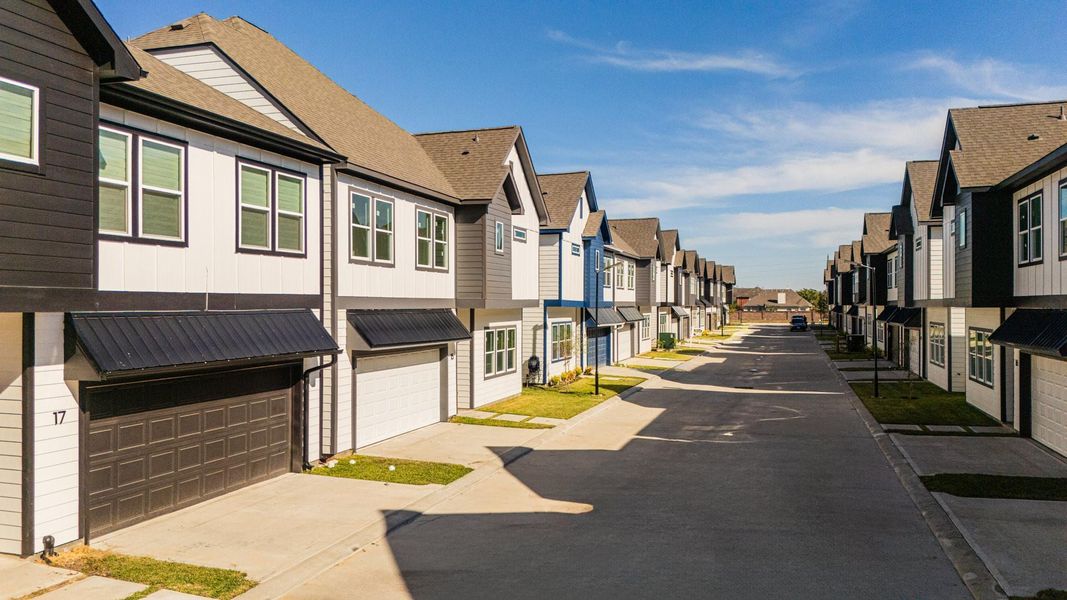 Front exterior of a new home in Metro Village, Houston, TX, highlighting curb appeal (Image 23).