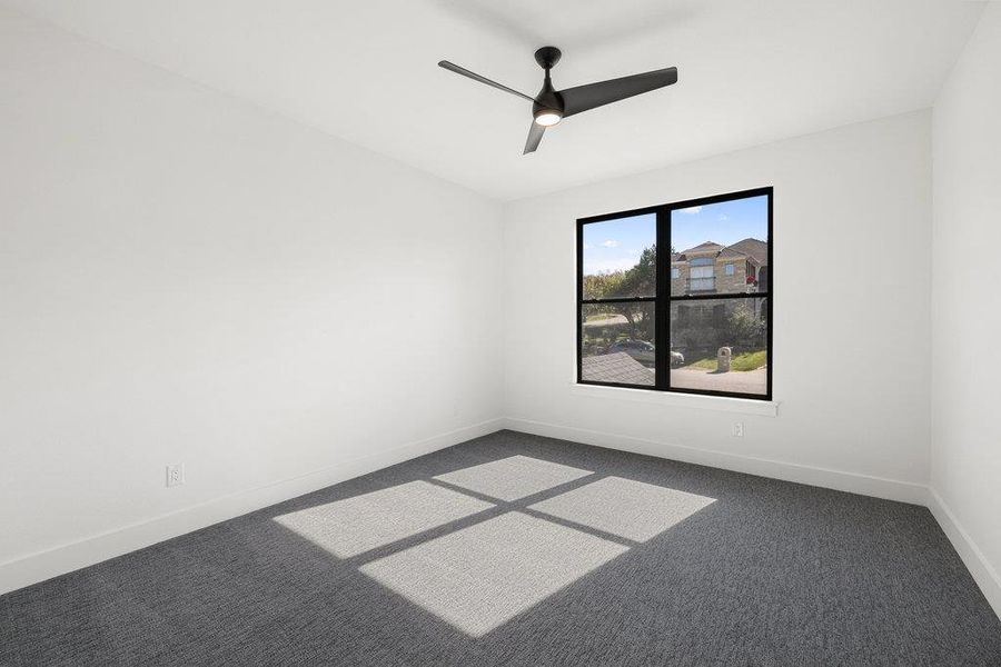 One of three bedrooms upstairs this room connects to a shared jack-n-jill bathroom and comes with a custom walk-in closet.