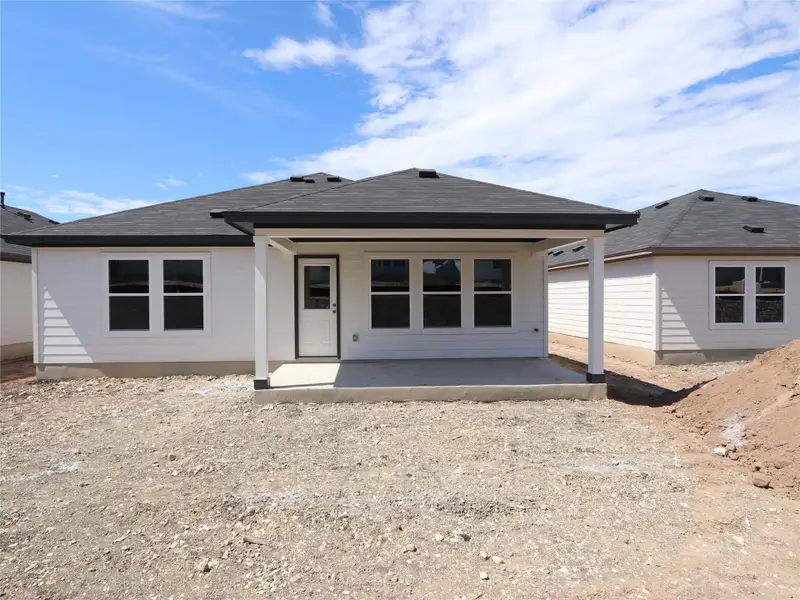 Front exterior of a new home in Marble Creek Crossing, Austin, TX, highlighting curb appeal (Image 2).