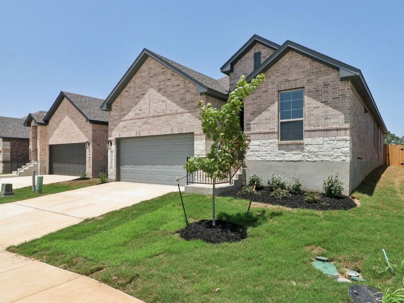 Front exterior of a new home in Kallison Ranch, San Antonio, TX, highlighting curb appeal (Image 21).
