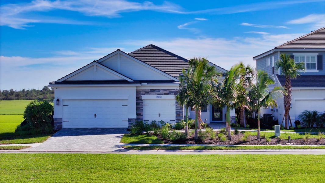 Representative exterior photo of a completed home built from the Sea Mist by Neal Communities in Palm Grove, Bradenton, FL (Image 21). Representative exterior photo of a completed home built from the Sea Mist by Neal Communities in Palm Grove, Bradenton, FL (Image 21).