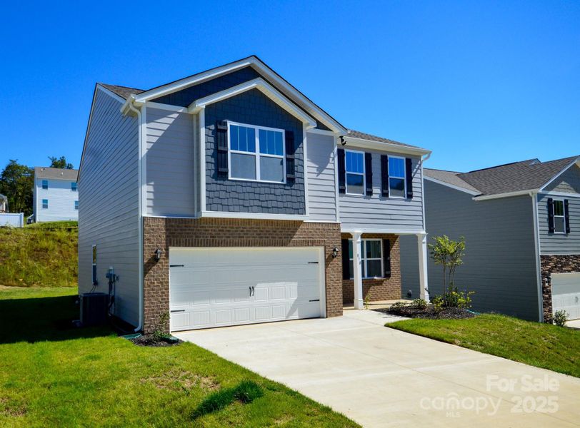 Front exterior of a new home in Rydele Heights, Asheville, NC, highlighting curb appeal (Image 2). Front exterior of a new home in Rydele Heights, Asheville, NC, highlighting curb appeal (Image 2).