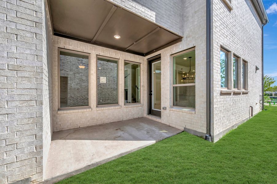 Exterior details and patio area of a home in Solterra - Cottage Series, Mesquite (Image 3).