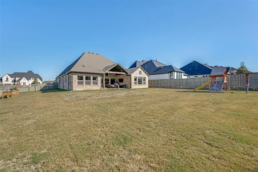Exterior details and patio area of a home in Pecan Square - Estates, Northlake (Image 2).