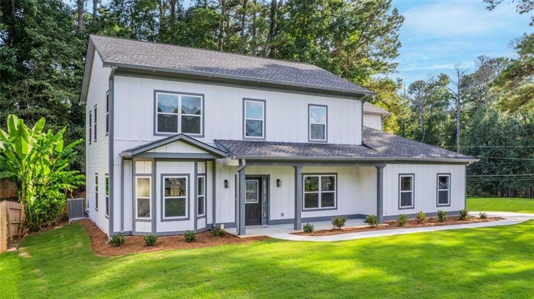 Front exterior of a new home in , Lithonia, GA, highlighting curb appeal (Image 2).