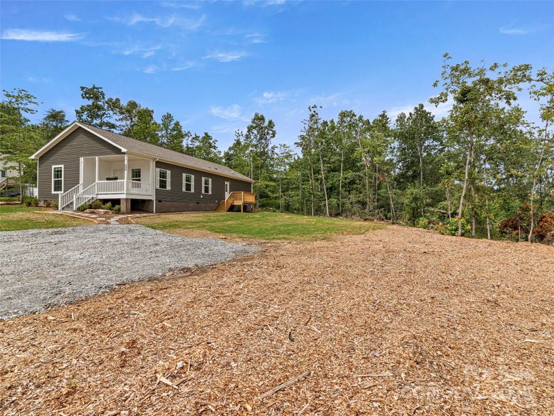 Front exterior of a new home in , Hendersonville, NC, highlighting curb appeal (Image 19).
