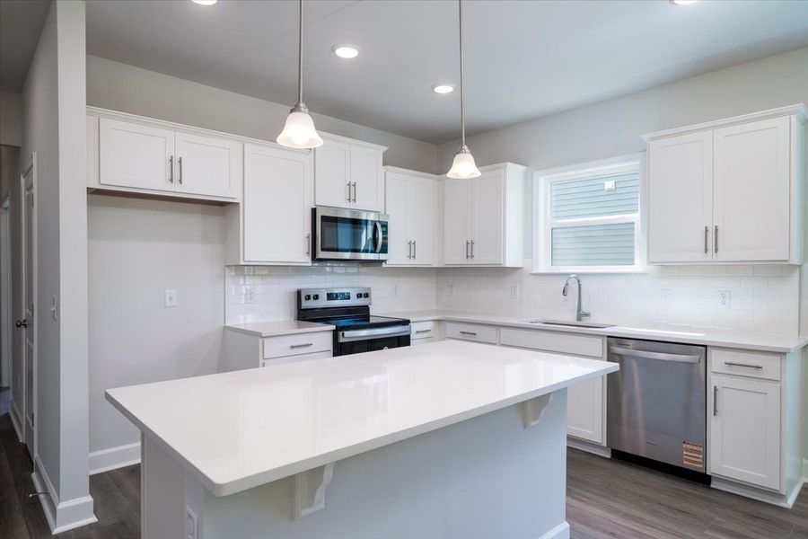 Open Kitchen with white cabinets and granite countertops. Open Kitchen with white cabinets and granite countertops.
