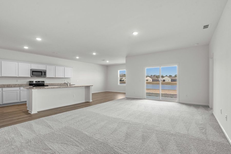 Representative unfurnished interior of a home built from the Europa by Starlight Homes in Oakfield Lakes, Parrish (Image 13).