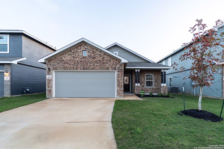 Front exterior of a new home in Hennersby Hollow, San Antonio, TX, highlighting curb appeal (Image 1). Front exterior of a new home in Hennersby Hollow, San Antonio, TX, highlighting curb appeal (Image 1).