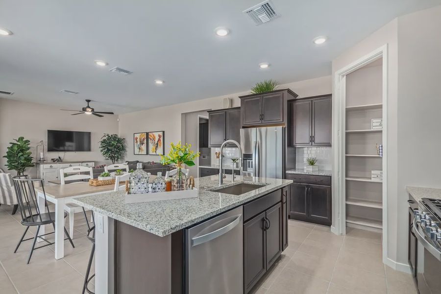 Representative furnished interior of a home built from the 1603 by Elliott Homes in Acacia at Santana, Yuma (Image 11).