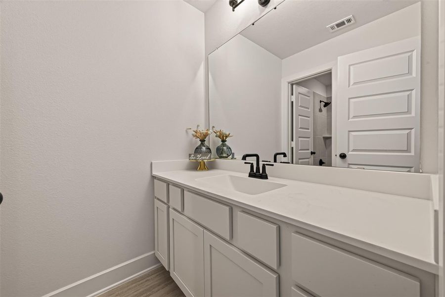 The secondary bathroom features modern finishes and a convenient tub and shower combination. The secondary bathroom features modern finishes and a convenient tub and shower combination.