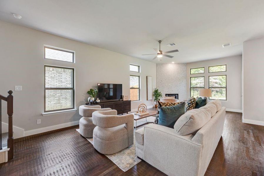 Extended fmily room of furnished model of same plan (no fireplace in this listing)