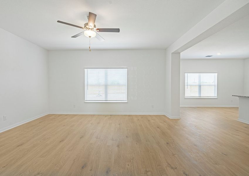 Spacious family room with a window overlooking the back yard