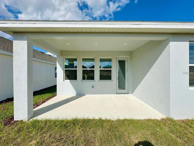 Exterior details and patio area of a home in Wellness Ridge: Estates Collection, Clermont (Image 16).