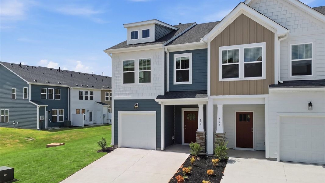 Elevated curb appeal with timeless stone accents and a welcoming covered entry by DRB Homes