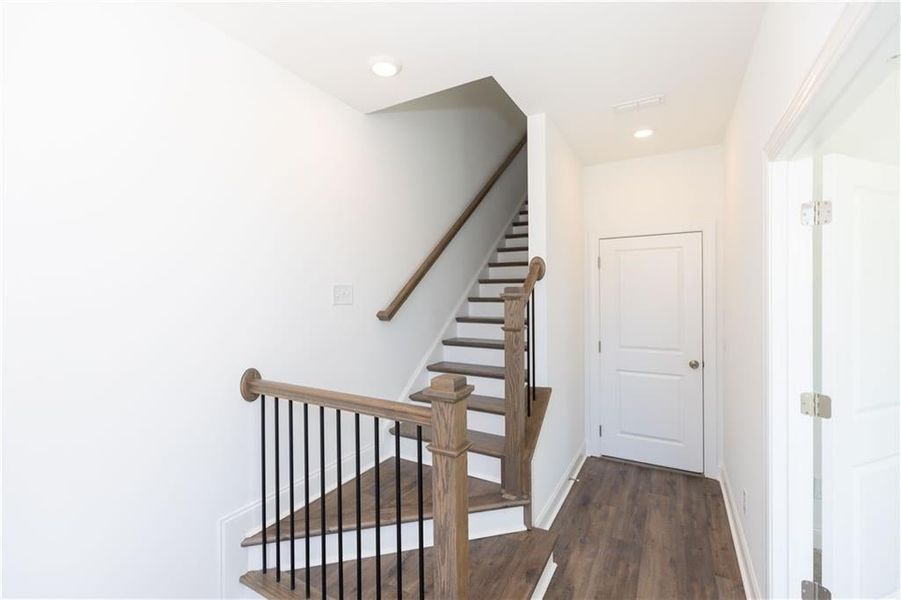 Foyer leads to the 2 car garage.**Photos of model house and not of actual home - Photos for representation purposes only **