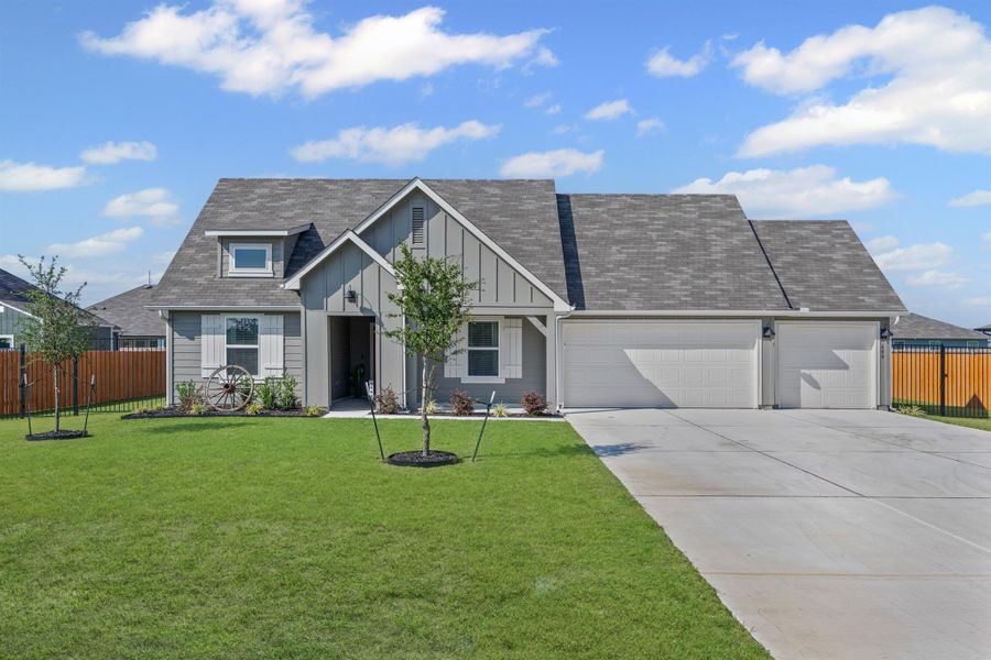 Front exterior of a new home in Hartland Ranch, Lockhart, TX, highlighting curb appeal (Image 18). Front exterior of a new home in Hartland Ranch, Lockhart, TX, highlighting curb appeal (Image 18).