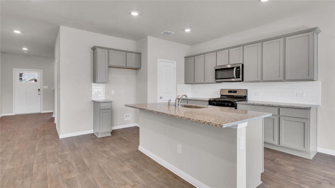 Furnished interior view inside a new home in Carillon, Manor (Image 8).