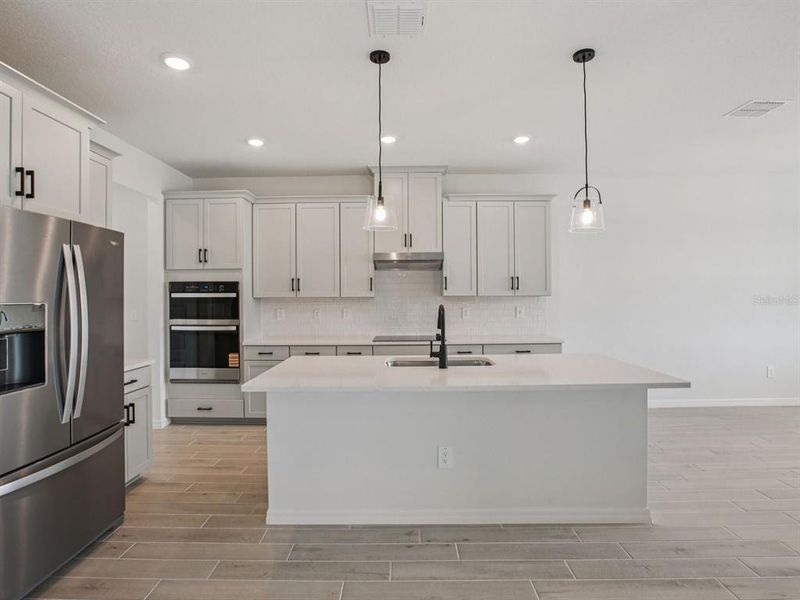 Furnished interior view inside a new home in Oakfield Trails - Signature Series, Parrish (Image 5).