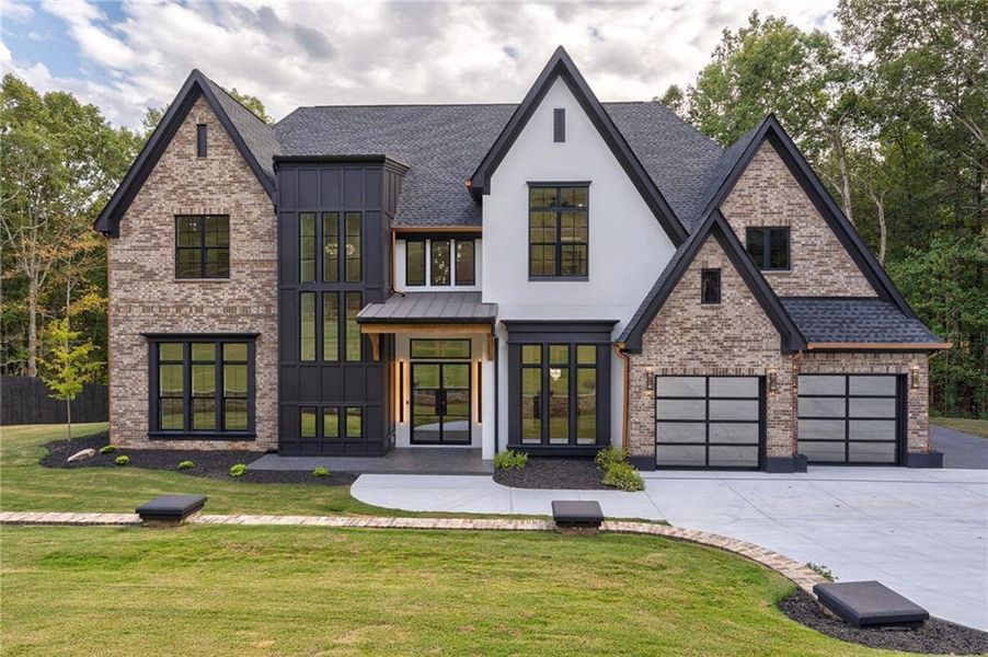 Front exterior of a new home in , Loganville, GA, highlighting curb appeal (Image 1). Front exterior of a new home in , Loganville, GA, highlighting curb appeal (Image 1).