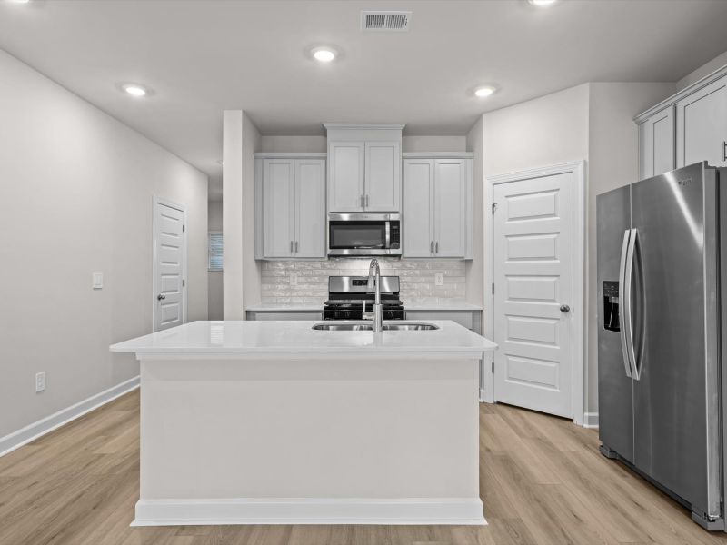 Furnished interior view inside a new home in Crossing at Abner Creek Townes, Greer (Image 5).