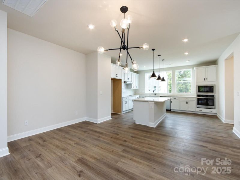 Designer Light Fixture Over Dining Space.