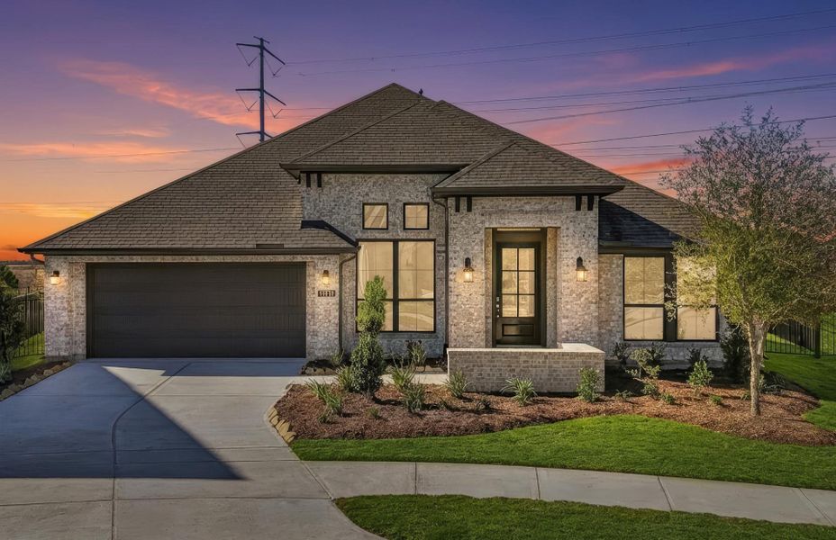 Front exterior of a new home in Bridgeland 60′, Cypress, TX, highlighting curb appeal (Image 2). Front exterior of a new home in Bridgeland 60′, Cypress, TX, highlighting curb appeal (Image 2).