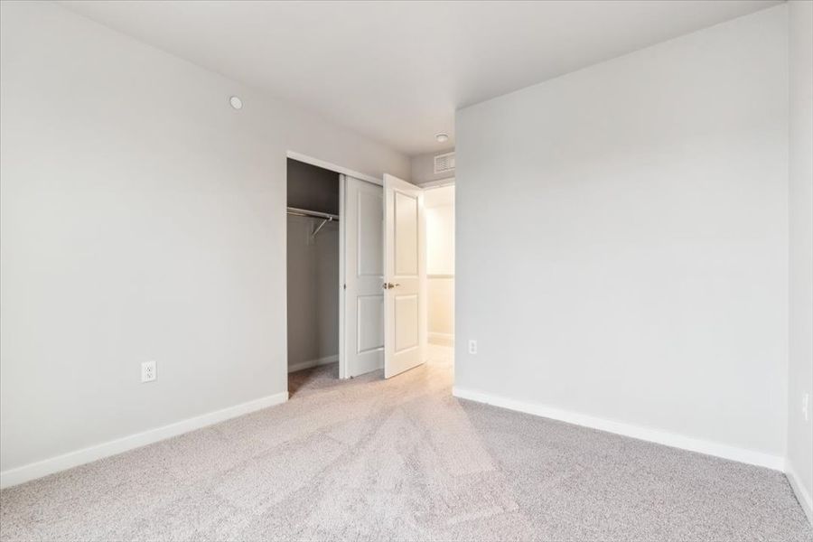 A hallway with white walls.