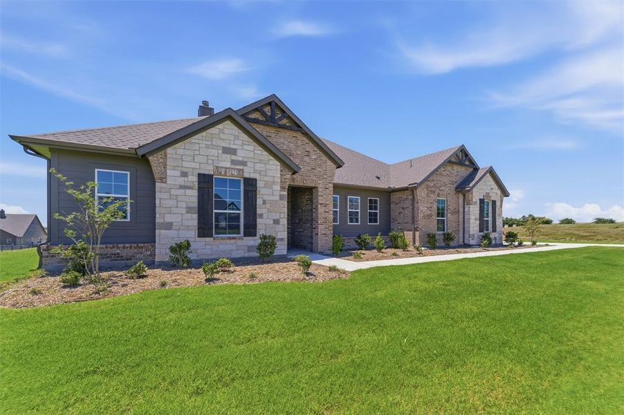 Contemporary ranch-style exterior featuring a mix of stone veneer and horizontal siding