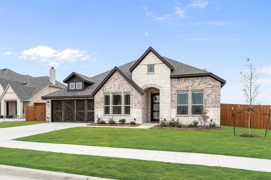 Front exterior of a new home in Sunrise at Garden Valley, Waxahachie, TX, highlighting curb appeal (Image 2).