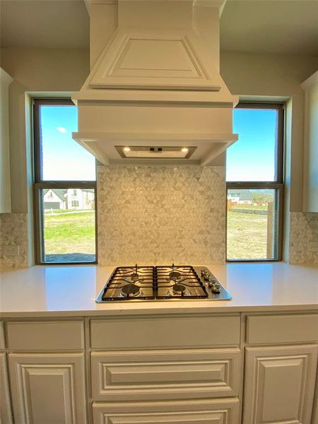GAS cooktop with custon cabinet vent hood to the outside, pot & pan drawers, and windows on each side for natural light GAS cooktop with custon cabinet vent hood to the outside, pot & pan drawers, and windows on each side for natural light
