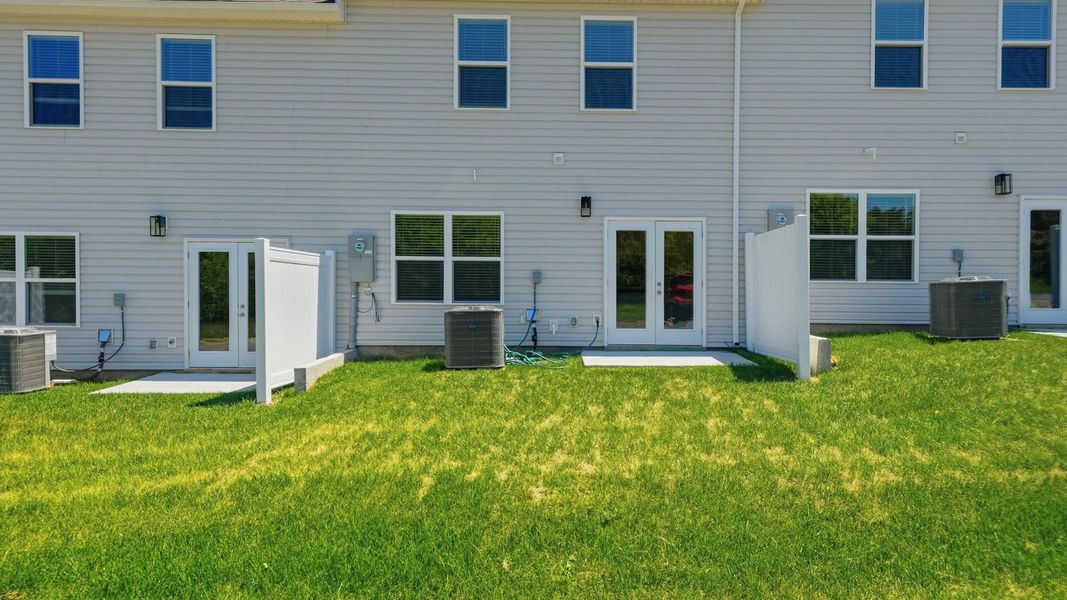 Exterior details and patio area of a home in The Arbor Townhomes, Kingsport (Image 3).