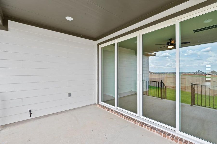 Exterior details and patio area of a home in Lariat, Liberty Hill (Image 22).