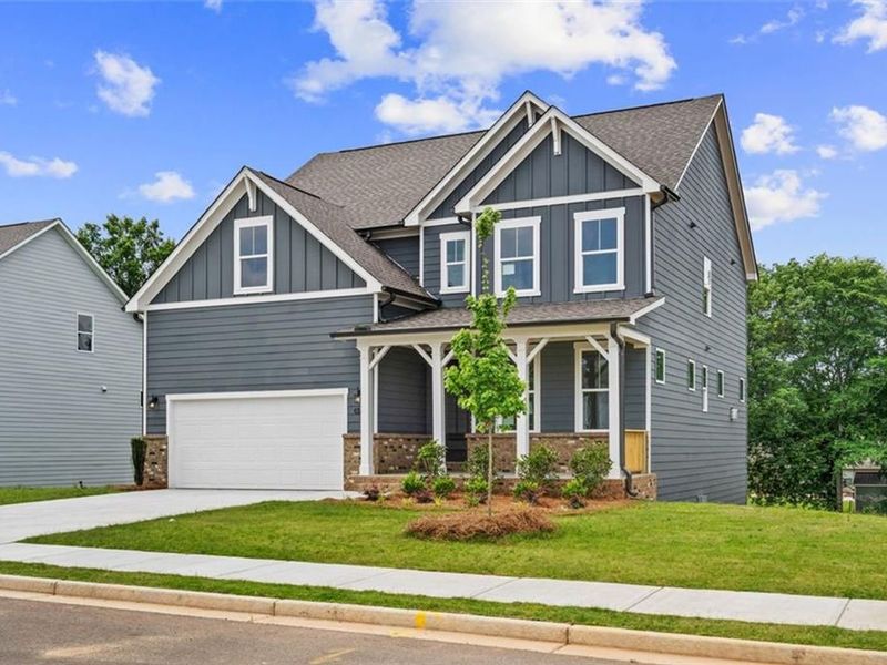 Front exterior of a new home in Wehunt Meadows, Hoschton, GA, highlighting curb appeal (Image 2).