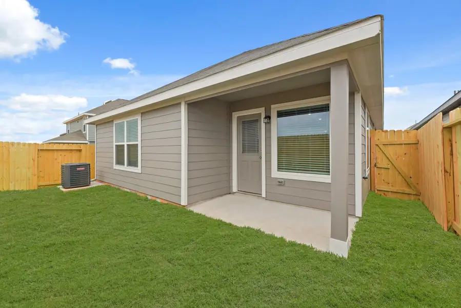 Front exterior of a new home in Ridgeland Hills, Willis, TX, highlighting curb appeal (Image 1). Front exterior of a new home in Ridgeland Hills, Willis, TX, highlighting curb appeal (Image 1).