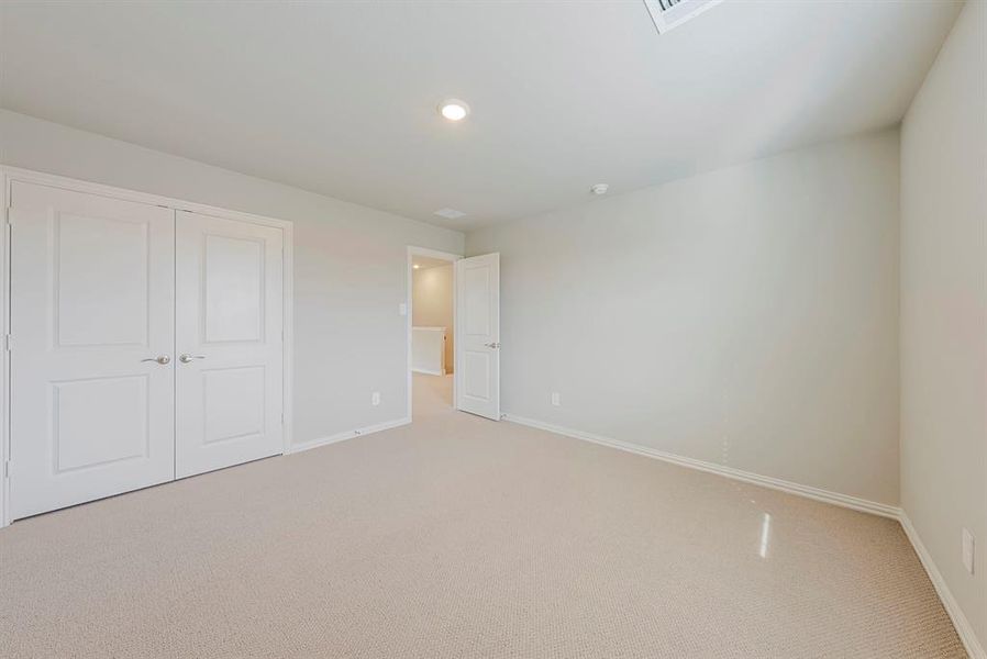 Unfurnished bedroom featuring carpet, a closet, and recessed lighting Unfurnished bedroom featuring carpet, a closet, and recessed lighting