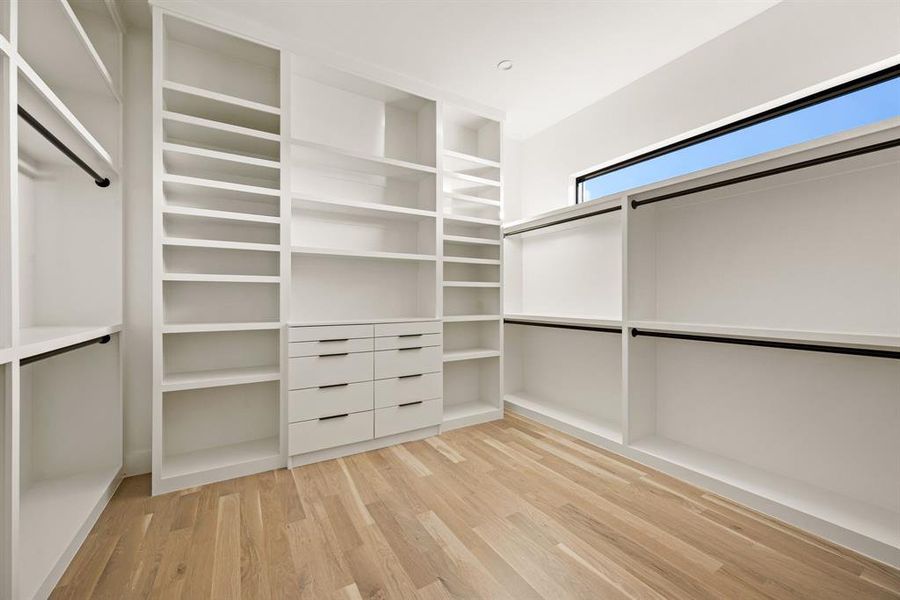 Expansive custom closet with built-ins. Expansive custom closet with built-ins.