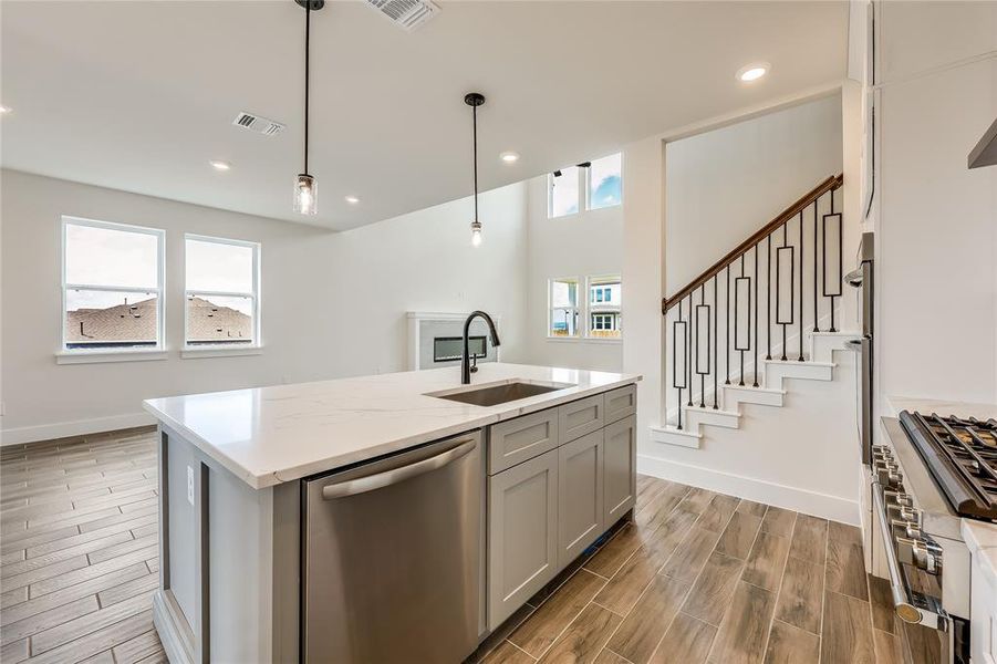 Stainless steel appliances and deep farmhouse sink make working in the kitchen a breeze with the ability to see everything that is going on in the home!