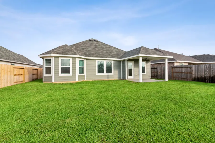 Exterior details and patio area of a home in Pinewood at Grand Texas, New Caney (Image 2).